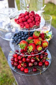 Display stand on the table full of fresh fruit Stock Photos