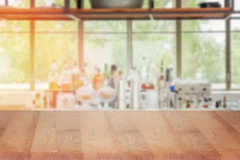 Display table with blurred bar on the background Stock Photos