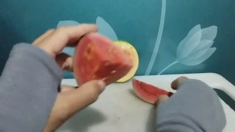 Display of three slices of red crystal guava with different shapes Stock Footage 229255204