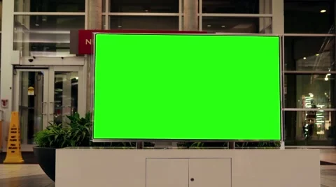 Display tv with green screen inside Coquitlam shopping mall entrance Stock Footage 64513142