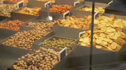 Display with variety of nuts, snacks and dried food in store. Delicious Video stock 317318648