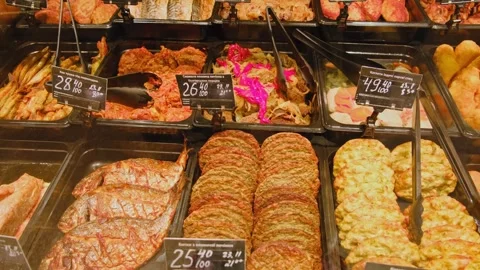 Display of various cooked dishes in a deli counter, Translation of text: hake in 스톡 동영상 295779746