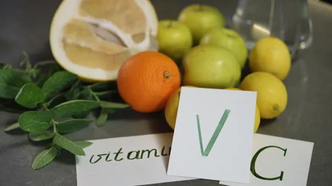  Display of Various Fruits with Labels Emphasizing Their High Vitamin C Content Stock Footage 310170993