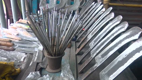 Display of Various Sharp Knives in Market Stall Stock Footage 319958567