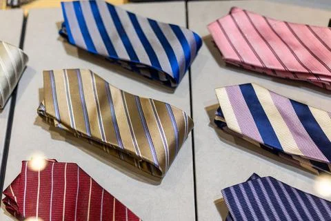 Display of vibrant ties showcasing various colors and patterns in a retail Stock Photos