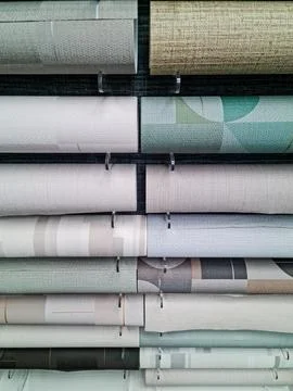 A display of wallpaper rolls in a store. Stock-Fotos