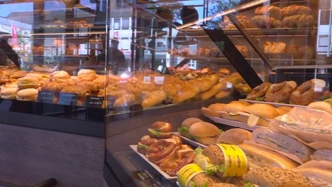 Display window in a traditional german bakery - sandwhiches and pastry Stock Footage 78690284