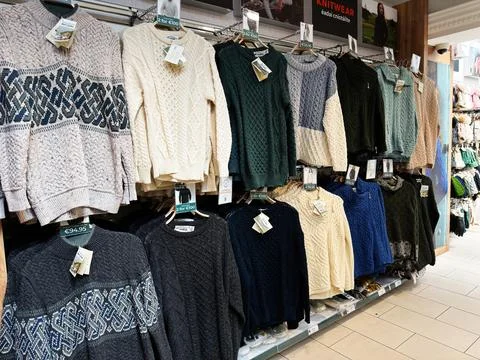 Display of wool knit sweaters on racks in a Dublin, Ireland shop showing tr.. Stock Photos