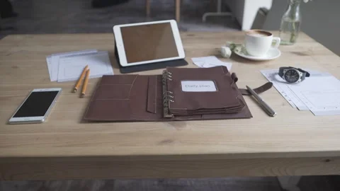 Display of work table desktop with tablet cell phone watch cup of hot coffee tea 動画素材 137538726