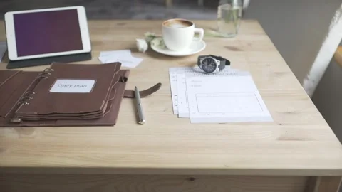 Display of working space area desktop wooden table with tablet cell phone watch  Stock Footage 137538658
