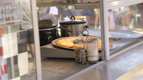 Displayed cheese pizza pickup window Stock Footage 253951447
