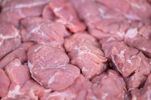 Displayed raw meat parcels emphasizing volume and supply nature. Raw protei.. 写真素材