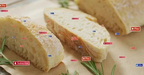 Displaying 3 crusty bread slices revealing open crumb on parchment, rosemary, Stock Photos