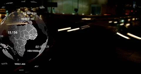 Displaying 3D globe overlaying left of night roadway, showing readouts and light 스톡 사진