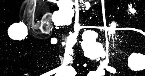 Displaying abstract white paint splatter pattern on canvas surface, featuring Stock Illustration