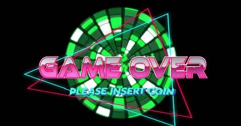 Displaying arcade on black backdrop with neon GAME OVER, cyan PLEASE INSERT COIN 库存照片