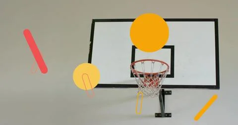 Displaying backboard black border, red rim, net and black bracket hanging on gym Stockfoto's