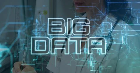 Displaying BIG DATA hologram while doctor in white coat at clinic writing on Stock Photos