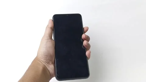 Displaying a black modern cellphone held in hand on a clear background Video stock 313381330