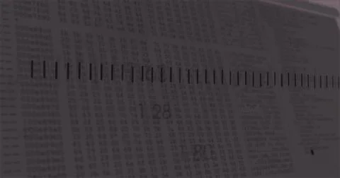 Displaying black ruler with tick marks crossing printed numeric table on desk, 库存插图