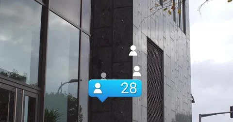 Displaying blue notification bubble showing user 28 on modern office facade, Stock Photos