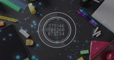 Displaying circular digital data overlay on dark desk workspace, with tablet Stock Photos