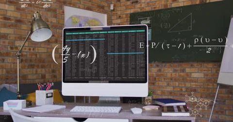 Displaying code output on all-in-one computer in brick office with formulas and Foto stock
