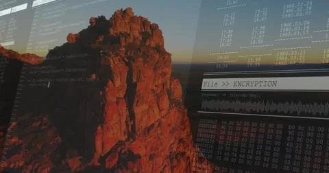 Displaying code on rugged cliff at sunset, with File  ENCRYPTION progress bar Stock Photos