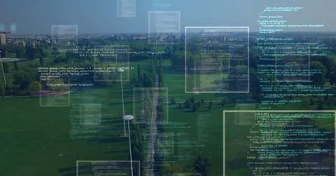 Displaying code windows hovering above walkway in urban park, with lamp posts Foto stock