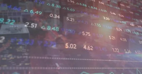 Displaying colored numeric stock data overlaying night city street, with trend Stock Photos