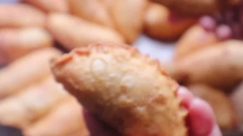 Displaying the crispy sound of samosa snacks Stock Footage 327352190