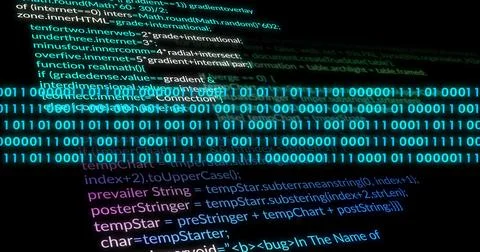 Displaying cyan binary stream flowing across dark-mode computer screen, with Foto stock