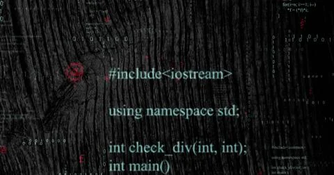 Displaying cyan C++ code snippet over wood-grain backdrop, with binary streams Stock Photos