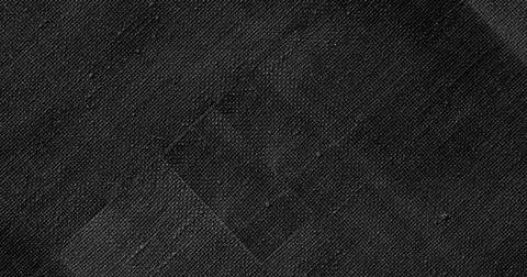 Displaying diagonal stitched square patch sitting on dark woven textile, Stock Photos