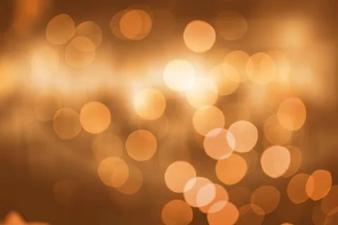Displaying flat design warm-tone bokeh circles forming abstract pattern on clear Foto stock