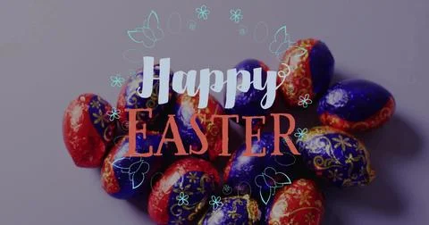 Displaying foil-wrapped Easter eggs glinting on mauve-gray tabletop, Happy Stock Photos
