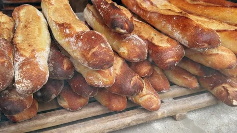 Displaying of freshly made tasty bread and crisp roasted baguettes through Stock Footage 274669793