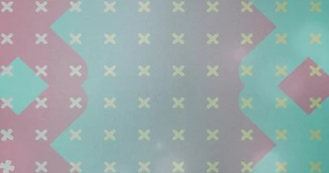 Displaying geometric patterned wallpaper with pale yellow Xs and scalloped pink Stock Photos