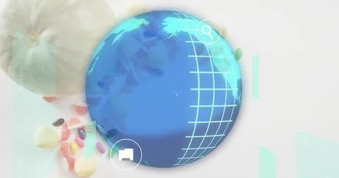 Displaying globe with cyan grid on tabletop, search and folder icons, candies Stock Photos