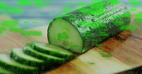 Displaying half cucumber resting on board at kitchen counter, with slices and Foto stock