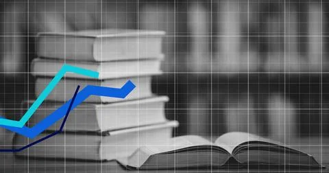 Displaying hardback stack and open book resting on wood table in library with Stock Photos
