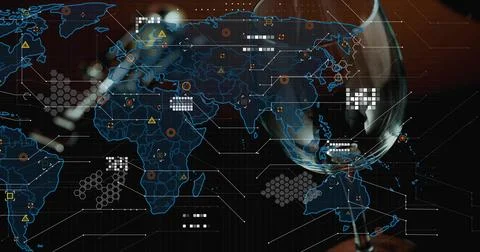 Displaying hologram map with data nodes, hexes in dim lounge, reflecting wine Foto stock