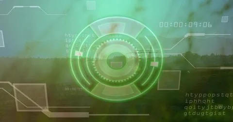 Displaying holographic circular interface over farmland and tree line, with code Stock Photos