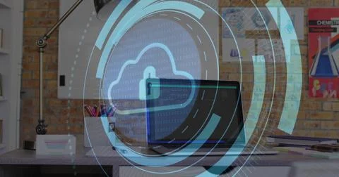 Displaying laptop showing cloud-lock HUD over home office desk, with lamp, pe Foto stock