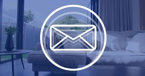 Displaying large white envelope icon overlaying living room center, with sofa Stock Photos