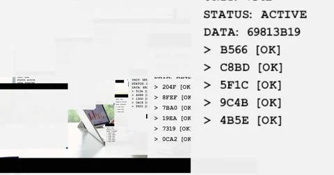 Displaying layout at desk with monospaced status text and silver laptop on Stock Photos