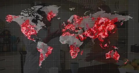 Displaying map with red hotspots over kitchen showing couple wearing aprons Fotos Stock