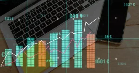 Displaying multicolored financial data visualization over work desk, with laptop Stock Photos