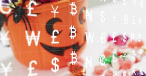 Displaying orange jackolantern sitting left on tabletop spider candies and cash Stock Photos