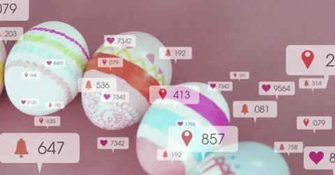 Displaying patterned pastel eggs on mauve tabletop, showing digital notification Stock Photos